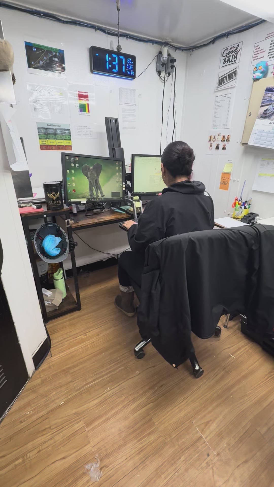 Professional woman in an office setting showing Alaya Shilajit as her secret for maintaining focus during long work shifts.