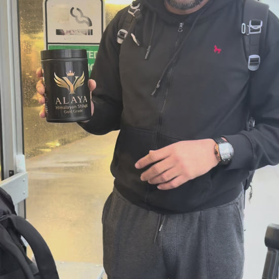 Young man outdoors recommending Alaya Shilajit as a 100% natural supplement for daily vitality and strength.